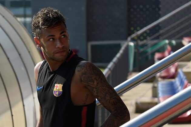 Barcelona's Brazilian forward Neymar arrives for a training session at the Sports Center FC Barcelona Joan Gamper in Sant Joan Despi, near Barcelona on July 17, 2017. / AFP PHOTO / LLUIS GENE        (Photo credit should read LLUIS GENE/AFP/Getty Images)