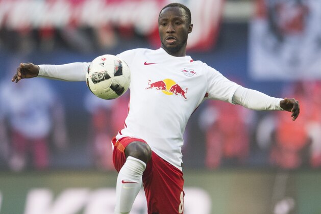 CORRECTION - Leipzig's Guinean midfielder Naby Keita plays the ball during the German First division Bundesliga football match of RB Leipzig vs VfL Wolfsburg in Leipzig, eastern Germany, on March 11, 2017.
 / AFP PHOTO / ROBERT MICHAEL / The erroneous mention[s] appearing in the metadata of this photo by ROBERT MICHAEL has been modified in AFP systems in the following manner: [Leipzig's Guinean midfielder Naby Keita plays the ball during the German First division Bundesliga football match of RB Leipzig vs VfL Wolfsburg in Leipzig, eastern Germany, on March 11, 2017.] instead of [Leipzig's Guinean midfielder Naby Keita plays the ball during the German First division Bundesliga football match Bayern Munich vs Eintracht Frankfurt in Munich, southern Germany, on March 11, 2017.]. Please immediately remove the erroneous mention[s] from all your online services and delete it (them) from your servers. If you have been authorized by AFP to distribute it (them) to third parties, please ensure that the same actions are