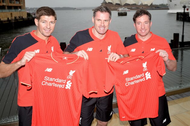 Former Liverpool football stars Steven Gerrard (L) Jamie Carragher (C) and Robbie Fowler (R) hold up Liverpool shirts in front of Sydney Harbour in Sydney on January 6, 2016.  Gerrard will pull on the famous Reds shirt once again when he plays for the club's 'Legends' side against Australia Legends in Sydney on January 7, 2016. AFP PHOTO / Peter PARKS  IMAGE STRICTLY FOR EDITORIAL USE - STRICTLY NO COMMERCIAL USE / AFP / PETER PARKS        (Photo credit should read PETER PARKS/AFP/Getty Images)