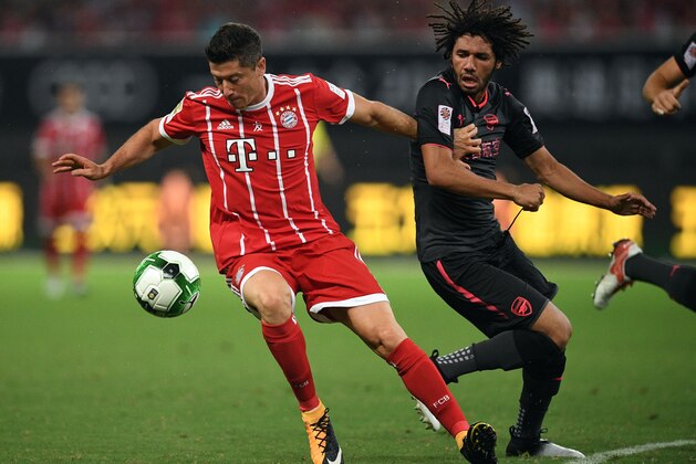 Bayern Munich's forward	Robert Lewandowski (L) and Arsenal midfielder Mohamed Elneny vie for the ball during the International Champions Cup football match between Bayern Munich and Arsenal in Shanghai on July 19, 2017.   / AFP PHOTO / Johannes EISELE        (Photo credit should read JOHANNES EISELE/AFP/Getty Images)