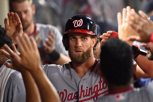 ANAHEIM, CA - JULY 18: Bryce Harper #34 of the Washington Nationals is greeted in the dugout after scoring a run on a single by Ryan Zimmerman #11 in the eighth inning of the game against the Los Angeles Angels of Anaheim at Angel Stadium of Anaheim on July 18, 2017 in Anaheim, California. (Photo by Jayne Kamin-Oncea/Getty Images) ANAHEIM, CA - JULY 18: Bryce Harper #34 of the Washington Nationals is greeted in the dugout after scoring a run on a single by Ryan Zimmerman #11 in the eighth inning of the game against the Los Angeles Angels of Anaheim at Angel Stadium of Anaheim on July 18, 2017 in Anaheim, California. (Photo by Jayne Kamin-Oncea/Getty Images)