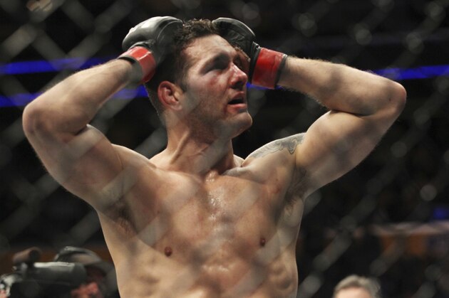 Chris Weidman reacts to his loss to Gerard Mousasi during a middleweight mixed martial arts bout at UFC 210, Saturday, April 8, 2017, in Buffalo, N.Y. (AP Photo/Jeffrey T. Barnes)