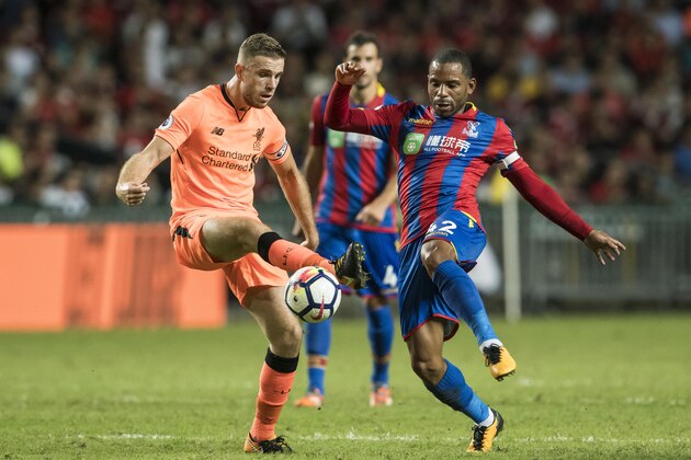 HONG KONG, HONG KONG - JULY 19: Liverpool FC midfielder Jordan Henderson (L) fights for the ball with Crystal Palace midfielder Jason Puncheon  (R) during the Premier League Asia Trophy match between Liverpool FC and Crystal Palace at Hong Kong Stadium on July 19, 2017 in Hong Kong, Hong Kong. (Photo by Victor Fraile/Getty Images)