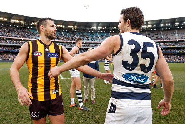 MELBOURNE, AUSTRALIA - JULY 15: Patrick Dangerfield of the Cats congratulates Luke Hodge of the Hawks on his 300th game during the 2017 AFL round 17 match between the Geelong Cats and the Hawthorn Hawks at the Melbourne Cricket Ground on July 15, 2017 in Melbourne, Australia. (Photo by Adam Trafford/AFL Media/Getty Images)