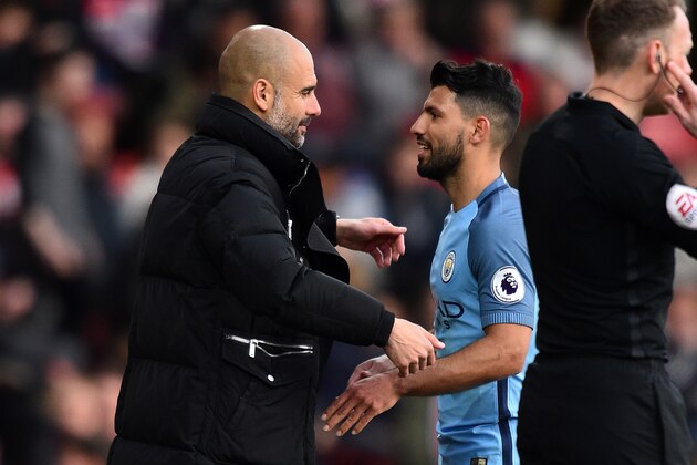 Manchester City's Spanish manager Pep Guardiola (L) embraces the substituted Sergio Aguero on the touchline during the English Premier League football match between Southampton and Manchester City at St Mary's Stadium in Southampton, southern England on April 15, 2017. / AFP PHOTO / Glyn KIRK / RESTRICTED TO EDITORIAL USE. No use with unauthorized audio, video, data, fixture lists, club/league logos or 'live' services. Online in-match use limited to 75 images, no video emulation. No use in betting, games or single club/league/player publications.  /         (Photo credit should read GLYN KIRK/AFP/Getty Images)
