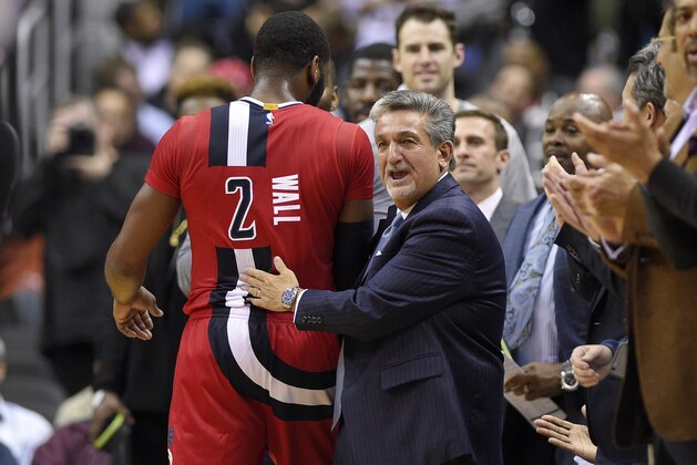 Washington Wizards team owner Ted Lenses, right, reacts with Washington Wizards guard John Wall (2) after Wall come out of the game during the second half of an NBA basketball game against the Boston Celtics, Tuesday, Jan. 24, 2017, in Washington. The Wizards won 123-108. (AP Photo/Nick Wass)