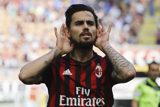 AC Milan's Suso celebrates after scoring the opening goal during a Serie A soccer match between AC Milan and Palermo, at the San Siro stadium in Milan, Italy, Sunday, April 9, 2017. (AP Photo/Luca Bruno)