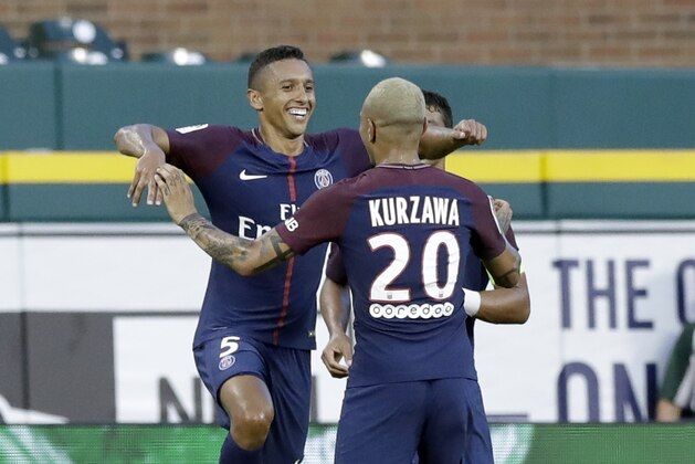 Marquinhos, left, of Paris Saint-Germain celebrates his goal with Layvin Kurzawa (20) during the first half of the International Champions Cup soccer game against AS Roma, Wednesday, July 19, 2017, in Detroit. (AP Photo/Carlos Osorio)