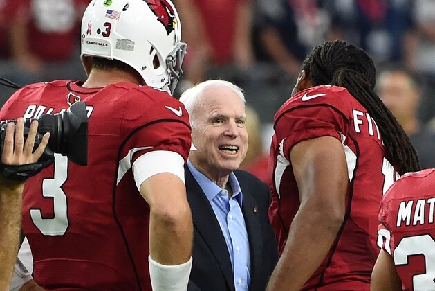 GLENDALE, AZ - SEPTEMBER 11:  Wide receiver Larry Fitzgerald #11 and Carson Palmer #3 of the Arizona Cardinals shakes hands with United States Senator John McCain prior to the coin flip before the start of a game against the New England Patriots at University of Phoenix Stadium on September 11, 2016 in Glendale, Arizona.  (Photo by Norm Hall/Getty Images)