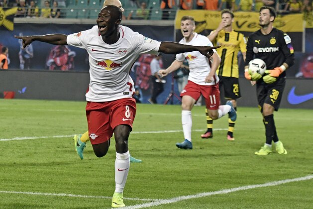 Leipzig's Naby Keita celebrates scoring a goal against Borussia Dortmund during the German first division Bundesliga soccer match between RB Leipzig and Borussia Dortmund in Leipzig, Germany, Saturday, Sept. 10, 2016. Leipzig won 1-0. (AP Photo/Jens Meyer)