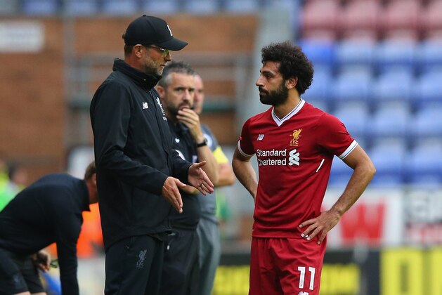 WIGAN, ENGLAND - JULY 14:  Jurgen Klopp the manager of Liverpool talks with Mohamed Salah of Liverpool during the pre-season friendly match between Wigan Athletic and Liverpool at DW Stadium on July 14, 2017 in Wigan, England.  (Photo by Alex Livesey/Getty Images)