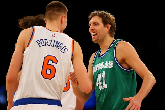 NEW YORK, NY - DECEMBER 07:  Kristaps Porzingis #6 of the New York Knicks and Dirk Nowitzki #41 of the Dallas Mavericks greet each other before the opening tipoff at Madison Square Garden on December 7, 2015 in New York City. NOTE TO USER: User expressly acknowledges and agrees that, by downloading and/or using this Photograph, user is consenting to the terms and conditions of the Getty Images License Agreement.  (Photo by Elsa/Getty Images)