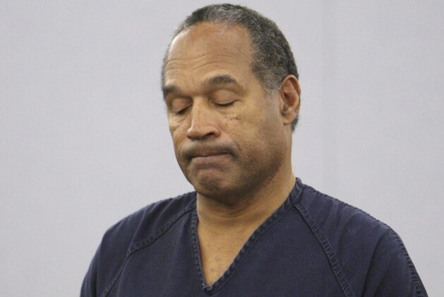 FILE - In this Dec. 5, 2008 pool file photo, O.J. Simpson appears during his sentencing hearing at the Clark County Regional Justice Center in Las Vegas. Simpson, the former football star, TV pitchman and now Nevada prison inmate, will have a lot going for him when he appears before state parole board members Thursday, July 20, 2017 seeking his release after more than eight years for an ill-fated bid to retrieve sports memorabilia. (AP Photo/Isaac Brekken, Pool, File)
