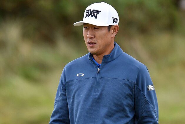 US golfer James Hahn walks on the 8th green during his opening round on the first day of the Open Golf Championship at Royal Birkdale golf course near Southport in north west England on July 20, 2017.
Wet, cool and breezy conditions, and enthusiastic crowds, greeted the first group of players to go out at 6:35am. / AFP PHOTO / Oli SCARFF / RESTRICTED TO EDITORIAL USE        (Photo credit should read OLI SCARFF/AFP/Getty Images)