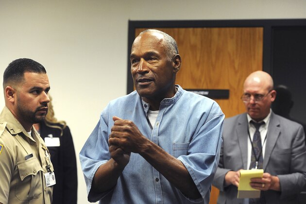 Former NFL football star O.J. Simpson reacts after learning he was granted parole at Lovelock Correctional Center in Lovelock, Nev., on Thursday, July 20, 2017.  Simpson was convicted in 2008 of enlisting some men he barely knew, including two who had guns, to retrieve from two sports collectibles sellers some items that Simpson said were stolen from him a decade earlier.   (Jason Bean/The Reno Gazette-Journal via AP, Pool)