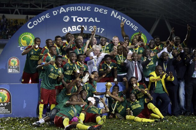 Cameroon players celebrate with the trophy after winning the African Cup of Nations final soccer match between Egypt and Cameroon at the Stade de l'Amitie, in Libreville, Gabon, Sunday, Feb. 5, 2017. Cameroon won 2-1. (AP Photo/Sunday Alamba)
