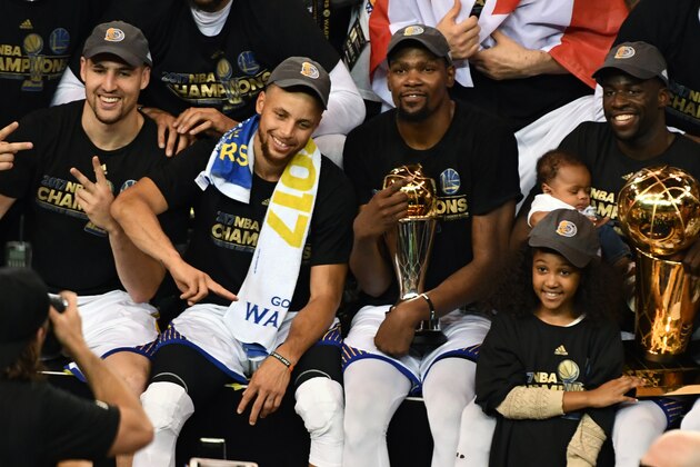 OAKLAND, CA - JUNE 12:  Klay Thompson #11, Stephen Curry #30, Kevin Durant #35 and Draymond Green #23 of the Golden State Warriors pose for a team photo after winning the NBA Championship and defeating the Cleveland Cavaliers in Game Five of the 2017 NBA Finals on June 12, 2017 at ORACLE Arena in Oakland, California. NOTE TO USER: User expressly acknowledges and agrees that, by downloading and or using this photograph, user is consenting to the terms and conditions of Getty Images License Agreement. Mandatory Copyright Notice: Copyright 2017 NBAE (Photo by Garrett Ellwood/NBAE via Getty Images)