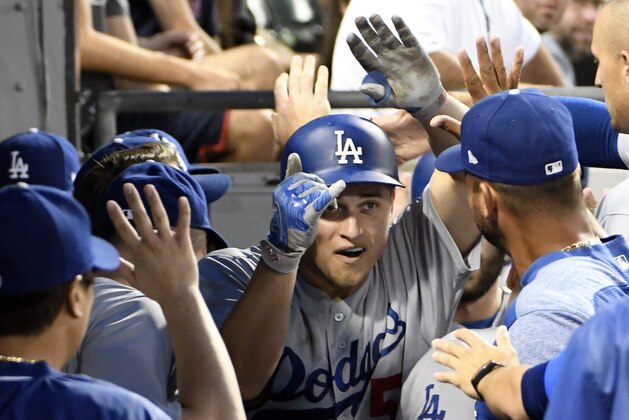 CHICAGO, IL - JULY 19: Corey Seager (C) of the Los Angeles Dodgers is greeted by after hitting a two-run homer against the Chicago White Sox during the fourth inning on July 19, 2017 at Guaranteed Rate Field  in Chicago, Illinois. (Photo by David Banks/Getty Images)