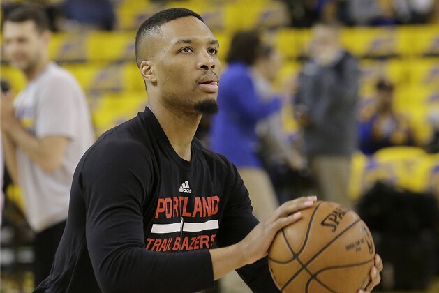 Portland Trail Blazers guard Damian Lillard warms up before Game 1 of a first-round NBA basketball playoff series between the Golden State Warriors and the Trail Blazers in Oakland, Calif., Sunday, April 16, 2017. (AP Photo/Jeff Chiu)