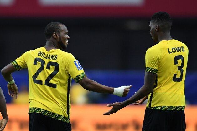 Jamaica's Romario Williams (L) celebrates with Damion Lowe after he scored a goal against Canada during their quarter final game in the 2017 CONCACAF Gold Cup at the University of Phoenix Stadium  in Glendale, Arizona on July 20, 2017. / AFP PHOTO / Robyn Beck        (Photo credit should read ROBYN BECK/AFP/Getty Images)