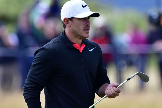 Jul 20, 2017; Southport, ENG; Brooks Koepka walks towards the 18th hole during the first round of The 146th Open Championship golf tournament at Royal Birkdale Golf Club. Mandatory Credit: Thomas J. Russo-USA TODAY Sports