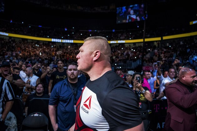 Jul 9, 2016; Las Vegas, NV, USA; Brock Lesnar (red gloves) enters T-Mobile Arena before his fight against Mark Hunt (blue gloves) during UFC 200 at T-Mobile Arena. Mandatory Credit: Joshua Dahl-USA TODAY Sports