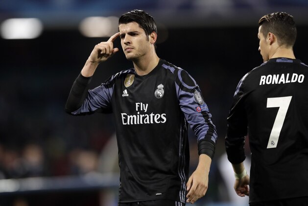 Real Madrid's Alvaro Morata gestures after scoring his side's third goal during the Champions League round of 16, second leg, soccer match between Napoli and Real Madrid at the San Paolo stadium in Naples, Italy, Tuesday March 7, 2017. (AP Photo/Andrew Medichini)