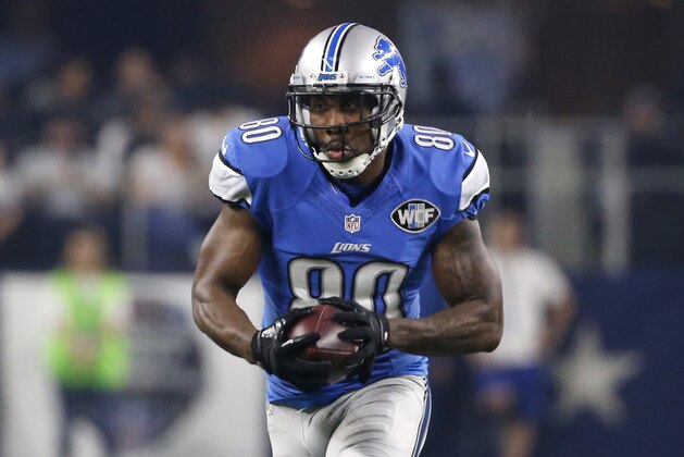 In this photo taken Dec. 26, 2016, then-Detroit Lions wide receiver Anquan Boldin (80) gains yardage after catching a pass during an NFL football game against the Dallas Cowboys, in Arlington, Texas. Boldin, Malcolm Jenkins of the Philadelphia Eagles and other players were meeting with members of Congress this week to push for legislation that leads to improved relationships between minority communities and local police(AP Photo/Michael Ainsworth)