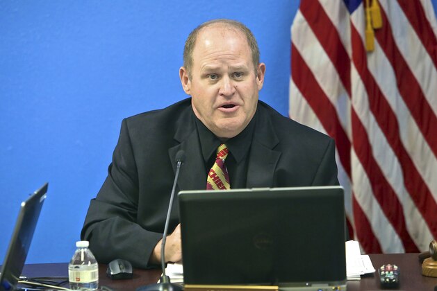 Nevada parole commissioner Adam Endel wears a Kansas City Chiefs tie while listening to testimony from former NFL football star O.J. Simpson, who is appearing by video conference, during Simpson's parole hearing in Carson City, Nev., Thursday, July 20, 2017. Simpson was granted parole Thursday after more than eight years in prison for a Las Vegas hotel heist, successfully making his case in a nationally televised hearing that reflected America's enduring fascination with the former football star. (Brad Coman/Nevada Appeal via AP, Pool) Nevada parole commissioner Adam Endel wears a Kansas City Chiefs tie while listening to testimony from former NFL football star O.J. Simpson, who is appearing by video conference, during Simpson's parole hearing in Carson City, Nev., Thursday, July 20, 2017. Simpson was granted parole Thursday after more than eight years in prison for a Las Vegas hotel heist, successfully making his case in a nationally televised hearing that reflected America's enduring fascination with the former football star. (Brad Coman/Nevada Appeal via AP, Pool)