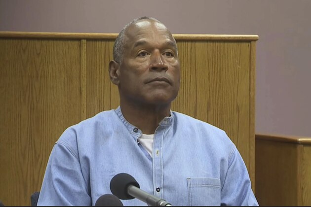 CORRECTS SOURCE TO KOLO-TV - Former NFL football star O.J. Simpson appears via video for his parole hearing at the Lovelock Correctional Center in Lovelock, Nev., on Thursday, July 20, 2017.  Simpson was convicted in 2008 of enlisting some men he barely knew, including two who had guns, to retrieve from two sports collectibles sellers some items that Simpson said were stolen from him a decade earlier. (KOLO-TV via AP, Pool)