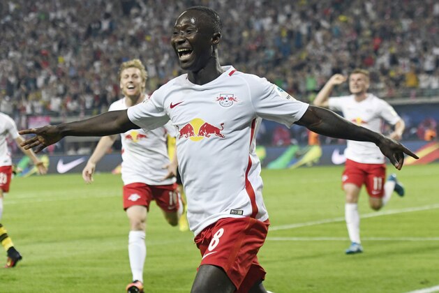 Leipzig's Naby Keita celebrates scoring against Borussia Dortmund during the German first division Bundesliga soccer match between RB Leipzig and Borussia Dortmund in Leipzig, Germany, Saturday, Sept. 10, 2016. Leipzig won by 1-0. (AP Photo/Jens Meyer)