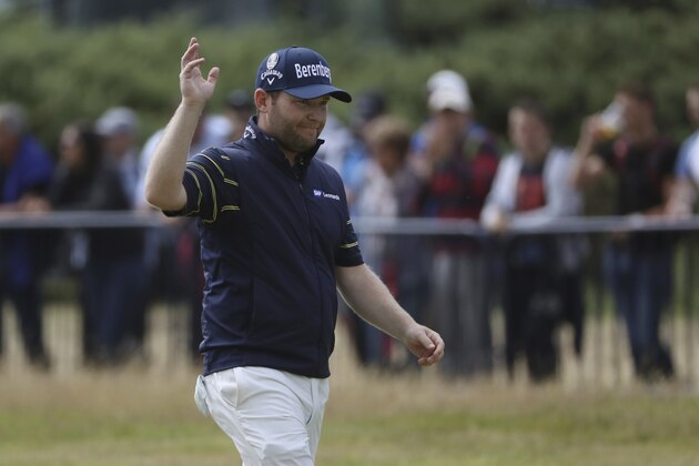 South Africa's Branden Grace waves as he makes his way along the 18th fairway during the third round of the British Open Golf Championship, at Royal Birkdale, Southport, England, Saturday July 22, 2017. (AP Photo/Peter Morrison)