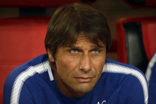 Chelsea's manager Antonio Conte watches the pregame ceremonies before the start of his team's friendly soccer match against Arsenal in Beijing, Saturday, July 22, 2017. Chelsea beat Arsenal, 3-0. (AP Photo/Mark Schiefelbein)