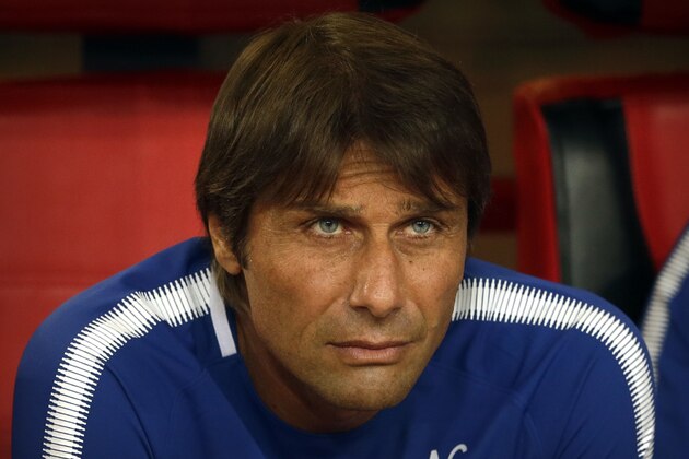 Chelsea's manager Antonio Conte watches the pregame ceremonies before the start of his team's friendly soccer match against Arsenal in Beijing, Saturday, July 22, 2017. Chelsea beat Arsenal, 3-0. (AP Photo/Mark Schiefelbein)