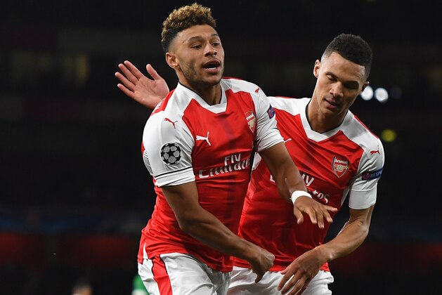 LONDON, ENGLAND - OCTOBER 19:  Alex Oxlade-Chamberlain of Arsenal celebrates with team mate Kieran Gibbs after scoring his team's third goal of the game during the UEFA Champions League group A match between Arsenal FC and PFC Ludogorets Razgrad at the Emirates Stadium on October 19, 2016 in London, England.  (Photo by Mike Hewitt/Getty Images)