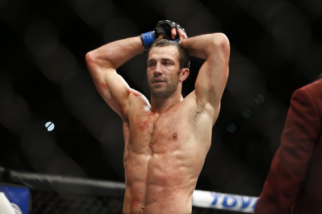 FILE - In this Dec. 12, 2015, file photo, Luke Rockhold rests between rounds as he fights Chris Weidman in a middleweight  championship mixed martial arts bout at UFC 194 in Las Vegas. Dominick Cruz has hated Urijah Faber for years, and Luke Rockhold has a deep dislike for Michael Bisping. UFC 199 is personal for both Cruz and Rockhold, who want to embarrass the challengers for their championship belts Saturday at the Forum.  (AP Photo/John Locher, File)