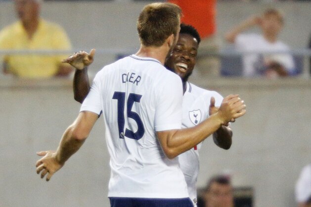 Eric Dier of Tottenham Hotspur (L) is congratulated by teammate Josh Onomah after scoring a goal against Paris Saint-Germain during their international friendly match on July 22, 2017 at Camping World Stadium in Orlando, Florida. / AFP PHOTO / Gregg Newton / Gregg Newton        (Photo credit should read GREGG NEWTON/AFP/Getty Images)