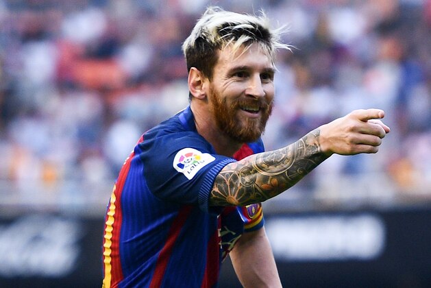 VALENCIA, SPAIN - OCTOBER 22:  Lionel Messi of FC Barcelona celebrates towards a TV camera after scoring his team's third from the penalty spot during the La Liga match between Valencia CF and FC Barcelona at Mestalla stadium on October 22, 2016 in Valencia, Spain.  (Photo by David Ramos/Getty Images)