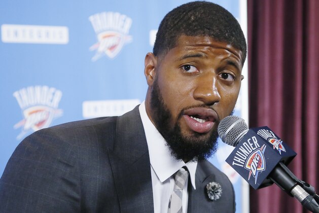 Oklahoma City Thunder forward Paul George answers a question at his first news conference since Oklahoma City's blockbuster trade with the Indiana Pacers, in Oklahoma City, Wednesday, July 12, 2017. (AP Photo/Sue Ogrocki)