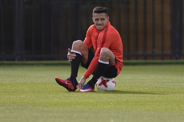 FILE - In this Saturday, June 24, 2017 file photo Chile's Alexis Sanchez attends a training session at the FC Strogino Stadium in Moscow, Russia.  Alexis Sanchez said Friday June 30, 2017  he’s reached a decision on his future at Arsenal, but won’t reveal it until after Sunday’s Confederations Cup final. (AP Photo/Daria Isaeva, file)