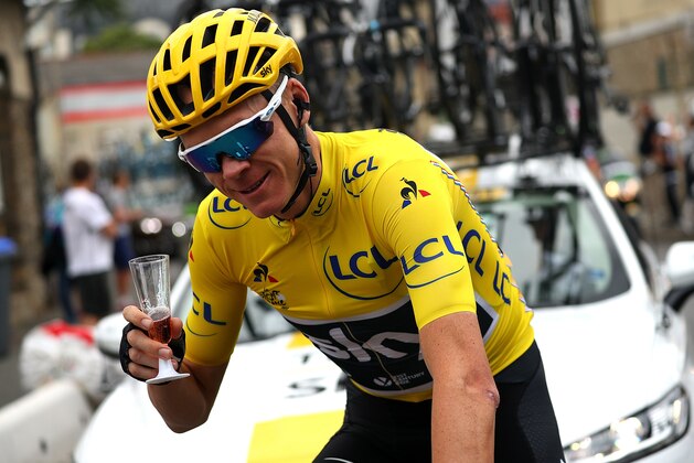 PARIS, FRANCE - JULY 23:  Chris Froome of Great Britain and Team Sky grabs a glass of champagne during stage twenty one of Le Tour de France 2017 on July 23, 2017 in Paris, France.  (Photo by Chris Graythen/Getty Images)