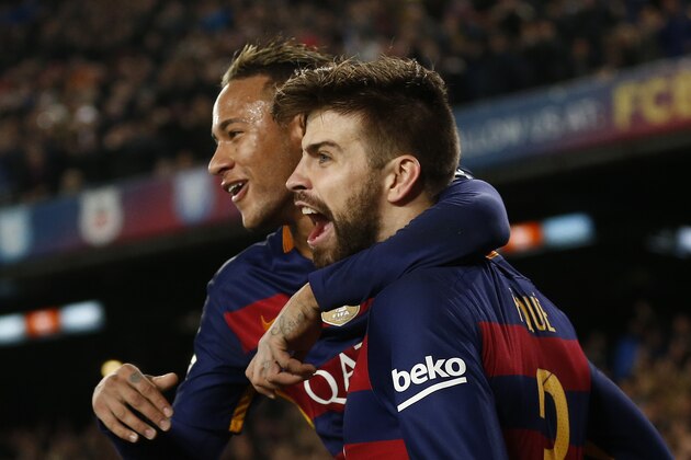 FC Barcelona's Gerard Pique, right, celebrates with his teammate Neymar after scoring against Athletic Bilbao during a quarterfinal, second leg, Copa del Rey soccer match at the Camp Nou stadium in Barcelona, Spain, Wednesday, Jan. 27, 2016. (AP Photo/Manu Fernandez)