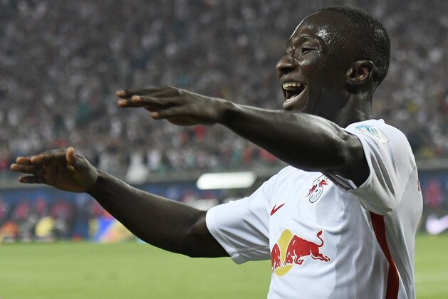 Leipzig's Naby Keita celebrates after scoring a goal against Borussia Dortmund during the German first division Bundesliga soccer match between RB Leipzig and Borussia Dortmund in Leipzig, Germany, Saturday, Sept. 10, 2016. Leipzig won 1-0. (AP Photo/Jens Meyer)