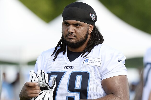 Tennessee Titans offensive guard Sebastian Tretola leaves the field after NFL football training camp Sunday, July 31, 2016, in Nashville, Tenn. (AP Photo/Mark Zaleski)