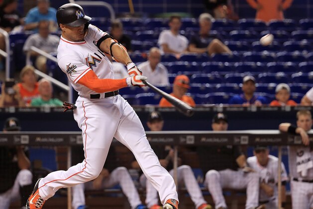 MIAMI, FL - JULY 19:  Giancarlo Stanton #27 of the Miami Marlins hits a solo home run in the first inning during a game against the Philadelphia Phillies at Marlins Park on July 19, 2017 in Miami, Florida.  (Photo by Mike Ehrmann/Getty Images)