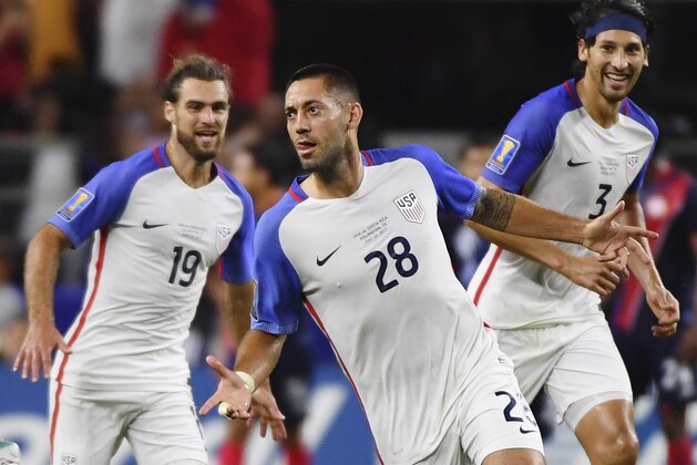 United States' Clint Dempsey (28) celebrates with teammates Graham Zusi, left, and Omar Gonzalez, right, after scoring a goal during a CONCACAF Gold Cup semifinal soccer match against Costa Rica in Arlington, Texas, Saturday, July 22, 2017. United States won 2-0. (AP Photo/Jeffrey McWhorter)