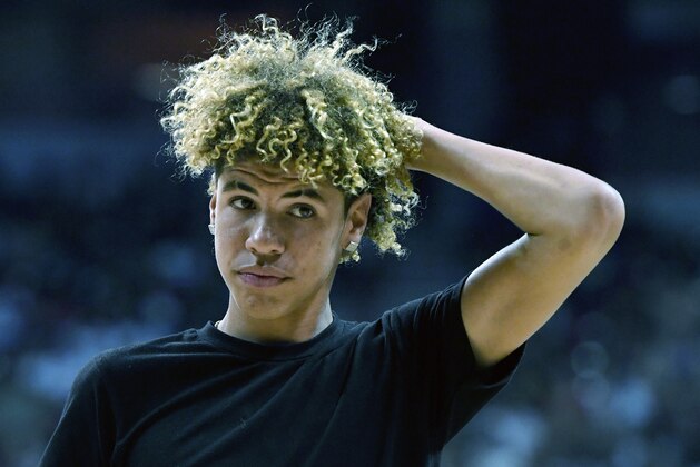 LAS VEGAS, NV - JULY 07:  LaMelo Ball, brother of Lonzo Ball #2 of the Los Angeles Lakers, walks off the court after shooting baskets as part of a promotion during a timeout of a 2017 Summer League game between the Lakers and the Los Angeles Clippers at the Thomas & Mack Center on July 7, 2017 in Las Vegas, Nevada. The Clippers won 96-93 in overtime. NOTE TO USER: User expressly acknowledges and agrees that, by downloading and or using this photograph, User is consenting to the terms and conditions of the Getty Images License Agreement.  (Photo by Ethan Miller/Getty Images)