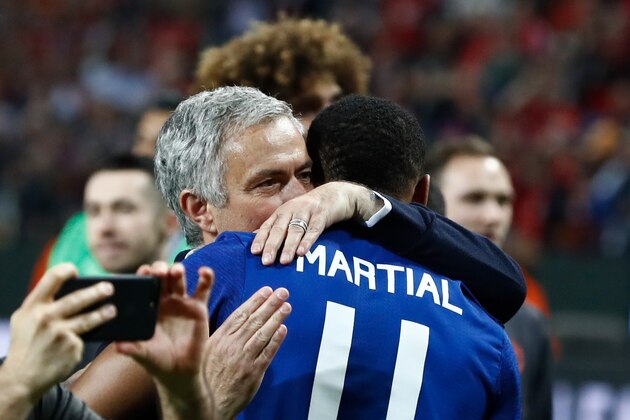 Manchester United's Portuguese manager Jose Mourinho celebrates French striker Anthony Martial after the UEFA Europa League final football match Ajax Amsterdam v Manchester United on May 24, 2017 at the Friends Arena in Solna outside Stockholm. / AFP PHOTO / Odd ANDERSEN        (Photo credit should read ODD ANDERSEN/AFP/Getty Images)