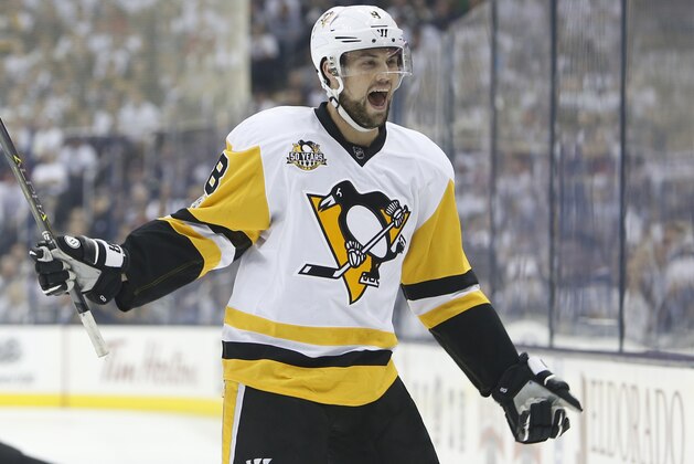 Pittsburgh Penguins' Brian Dumoulin celebrates their goal against the Columbus Blue Jackets during the first period in Game 3 of a first-round NHL hockey playoff series Sunday, April 16, 2017, in Columbus, Ohio. (AP Photo/Jay LaPrete)