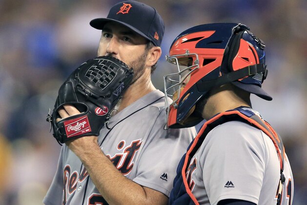 Detroit Tigers starting pitcher Justin Verlander, left, talks with catcher Alex Avila during the sixth inning of the team's baseball game against the Kansas City Royals at Kauffman Stadium in Kansas City, Mo., Wednesday, July 19, 2017. (AP Photo/Orlin Wagner)